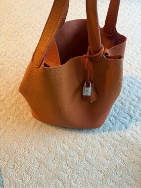 Pebbled Orange Bucket Tote with Silver Padlock Accent
